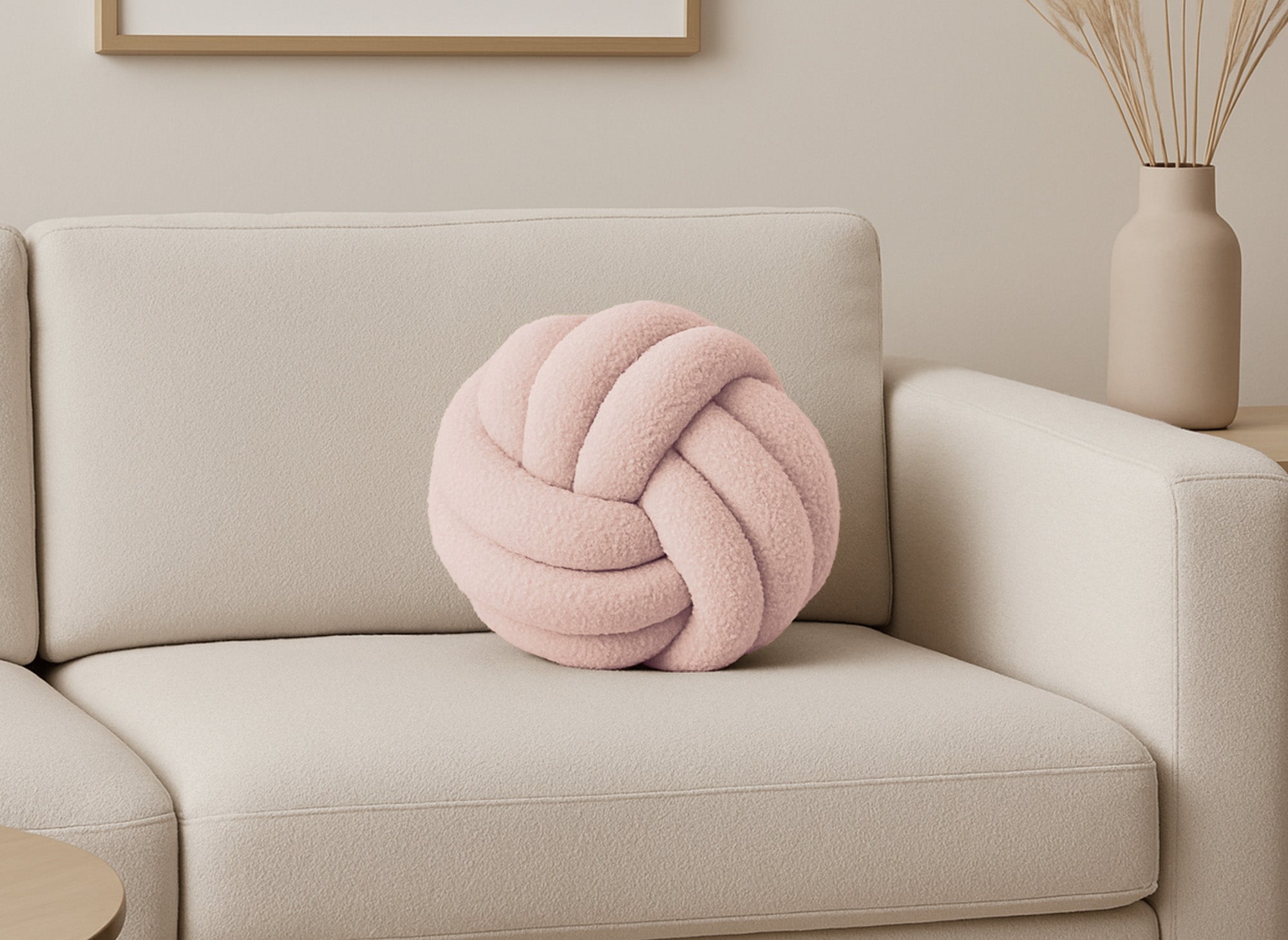 Coussin rond décoratif boule de nœud en effet peau de mouton rose NODUS